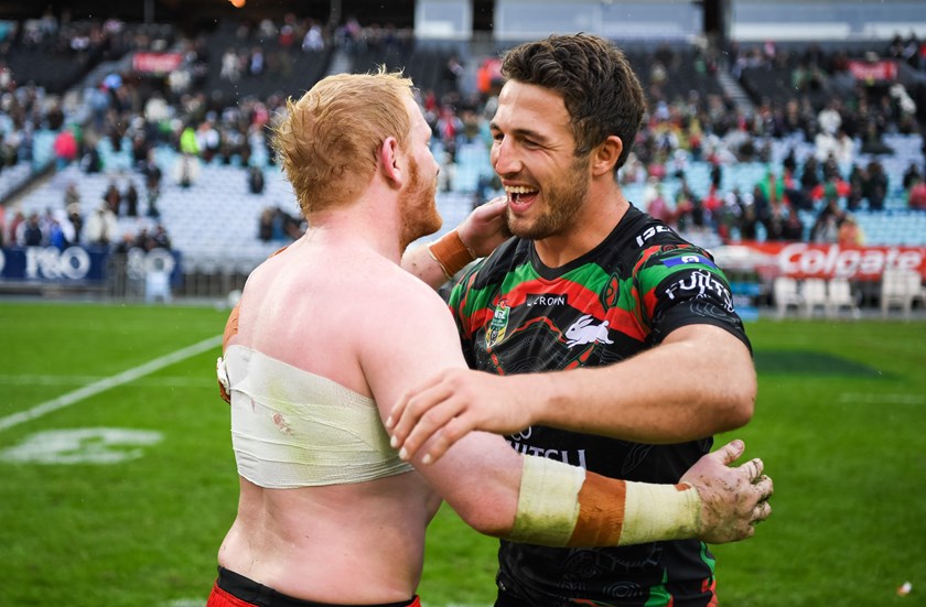 James Graham and Sam Burgess embrace after the round 10 clash won by the Rabbitohs.