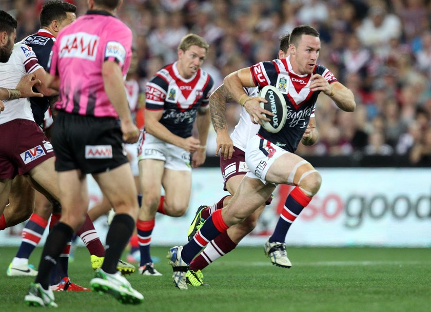 James Maloney makes a break for the Roosters in 2013.