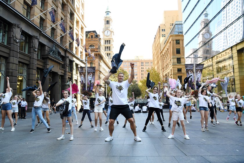 Trent Merrin and his dancing partners at Martin Place.