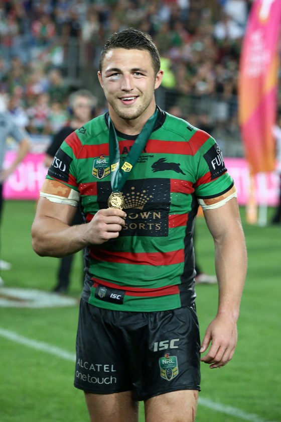 Rabbitohs forward Sam Burgess proudly displays the Clive Churchill Medal he won as the man of the match in the 2014 grand final.