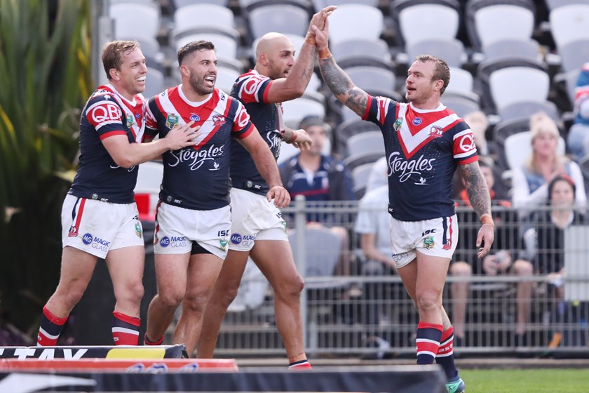 Roosters Mitch Aubusson, James Tedesco, Blake Ferguson and Jake Friend celebrate a try.