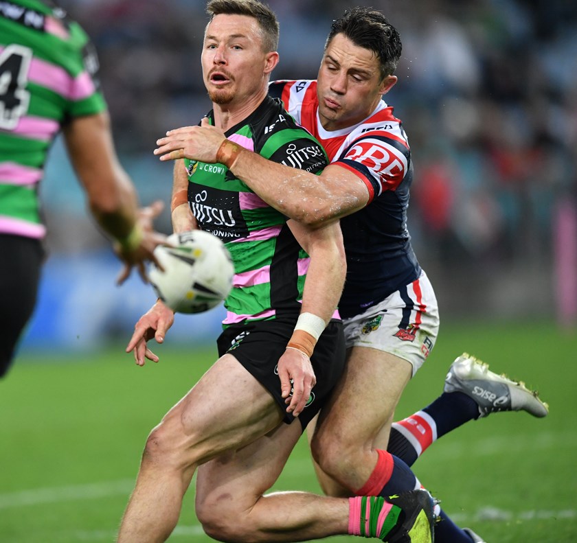 Roosters halfback Cooper Cronk (right) wraps up Rabbitohs hooker Damien Cook.