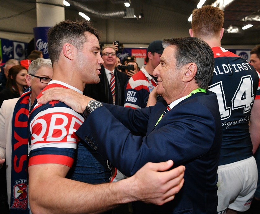 Cooper Cronk and Roosters chairman Nick Politis after the 2018 grand final.