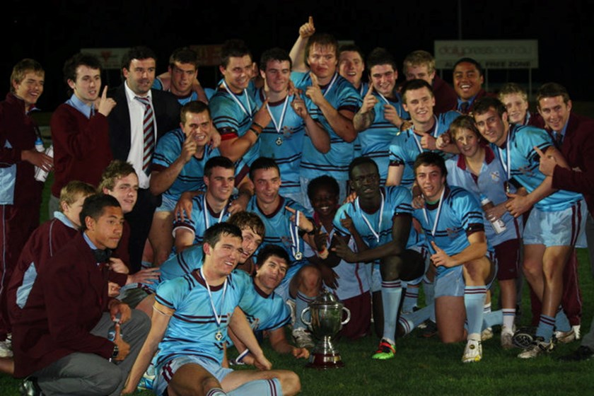 Roosters fullback James Tedesco with the 2010 champion St Gregory's schoolboys side. Tedesco is front and left, lying beside the Metropolitan Catholic Schools Trophy.
