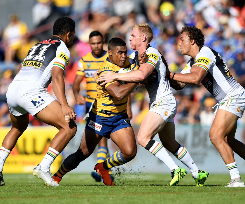 Penrith's Peter Wallace tackles Eels centre Michael Jennings.