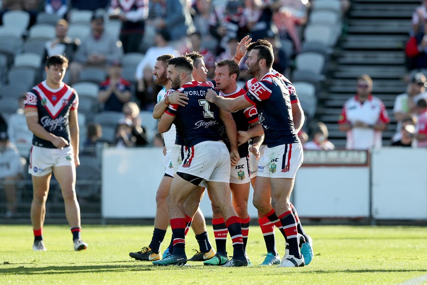 The Roosters celebrate a James Tedesco try.