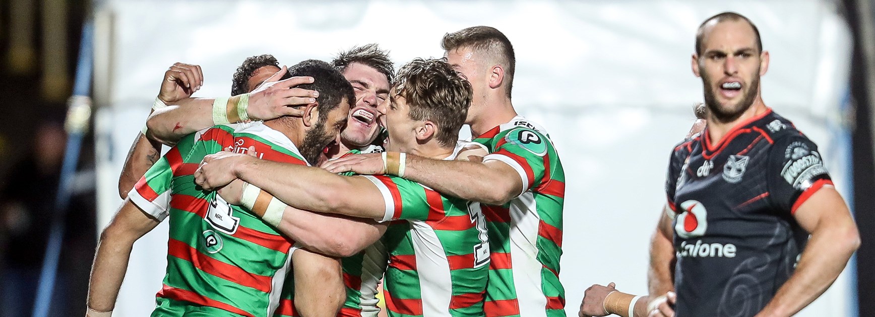 The Rabbitohs celebrate a try against the Warriors.