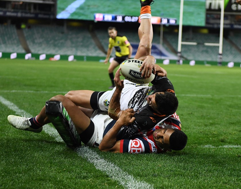 Sydney Roosters winger Anthony Tupou pulls off a trysaver.
