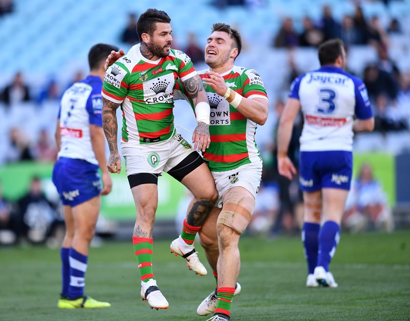 Adam Reynolds (left) and Angus Crichton celebrate Reynolds' try against the Bulldogs.