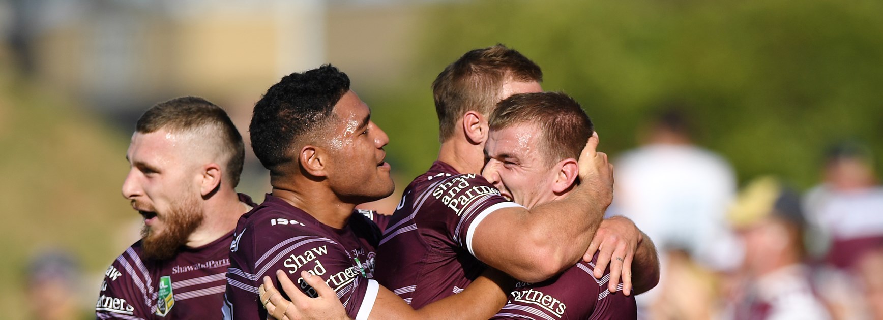 Manly five-eighth Lachlan Croker celebrates with teammates after his try against the Eels.