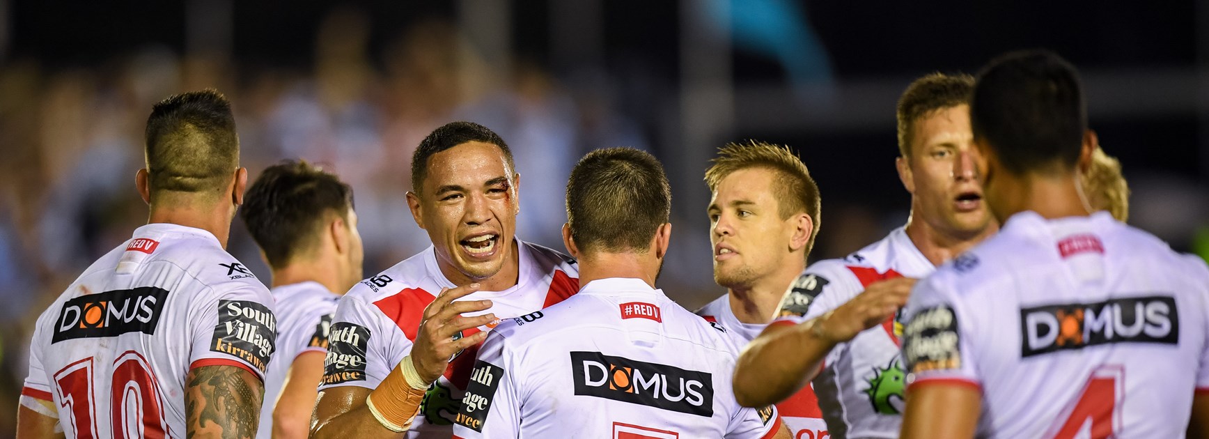 Dragons back-rower Tyson Frizell and teammates celebrate win over Sharks.