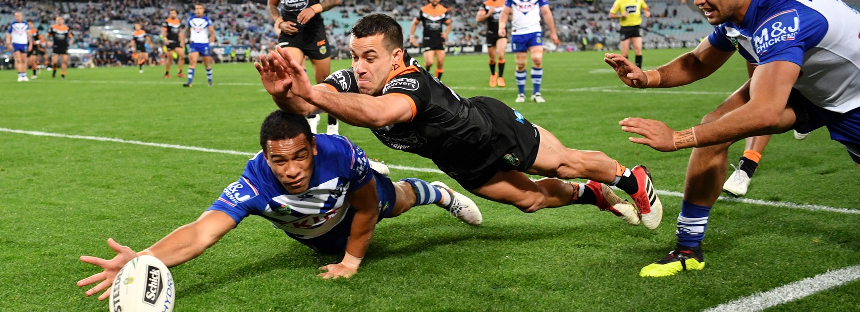 Will Hopoate keeps the ball away from Corey Thompson.