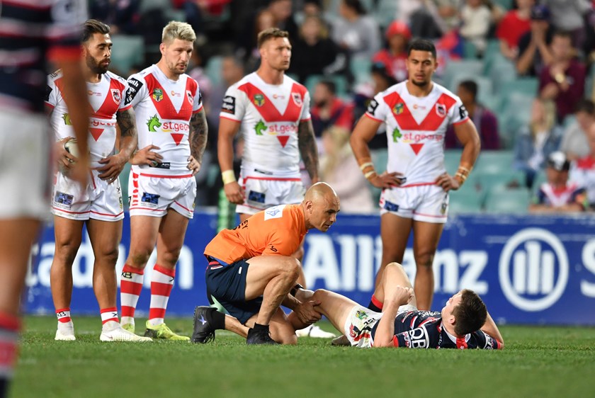 Roosters five-eighth Luke Keary goes down injured in round 20 against the Dragons.