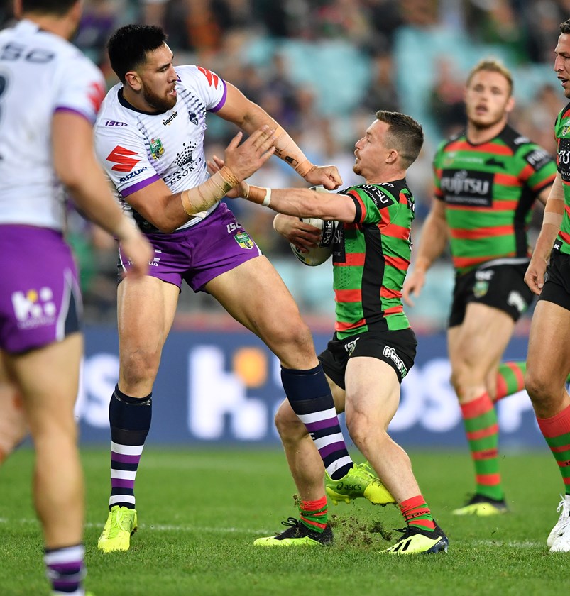 Damien Cook tangles with the much-larger Nelson Asofa-Solomona.