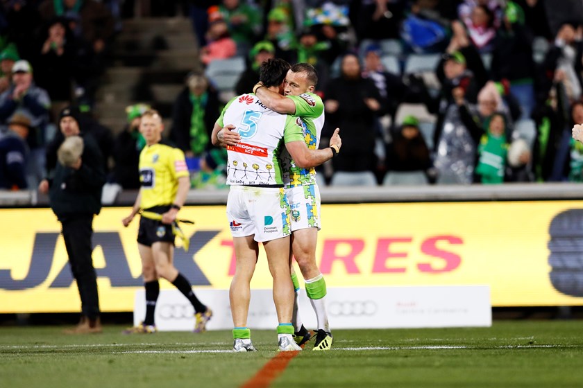 Josh Hodgson and Jordan Rapana celebrate the win over the Roosters.
