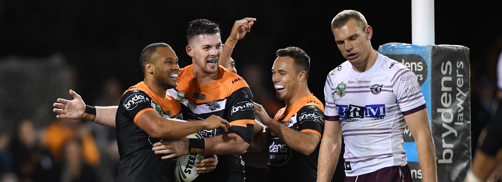 Wests Tigers celebrate Moses Mbye try.