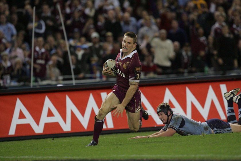 Brent Tate evades Steven Menzies to score in 2006.