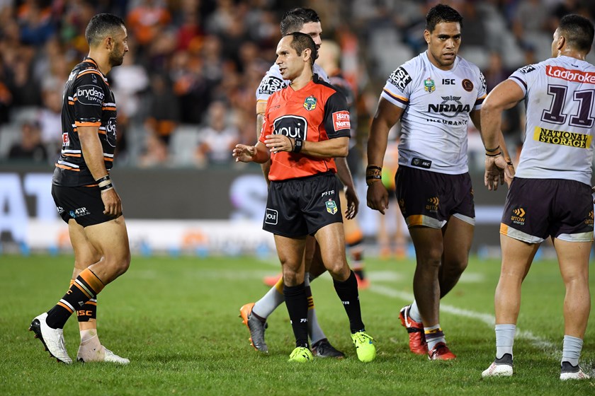 Referee Ashley Klein explains to Wests Tigers five-eighth Benji Marshall why he penalised Tigers back-rower Robbie Rochow against the Broncos.