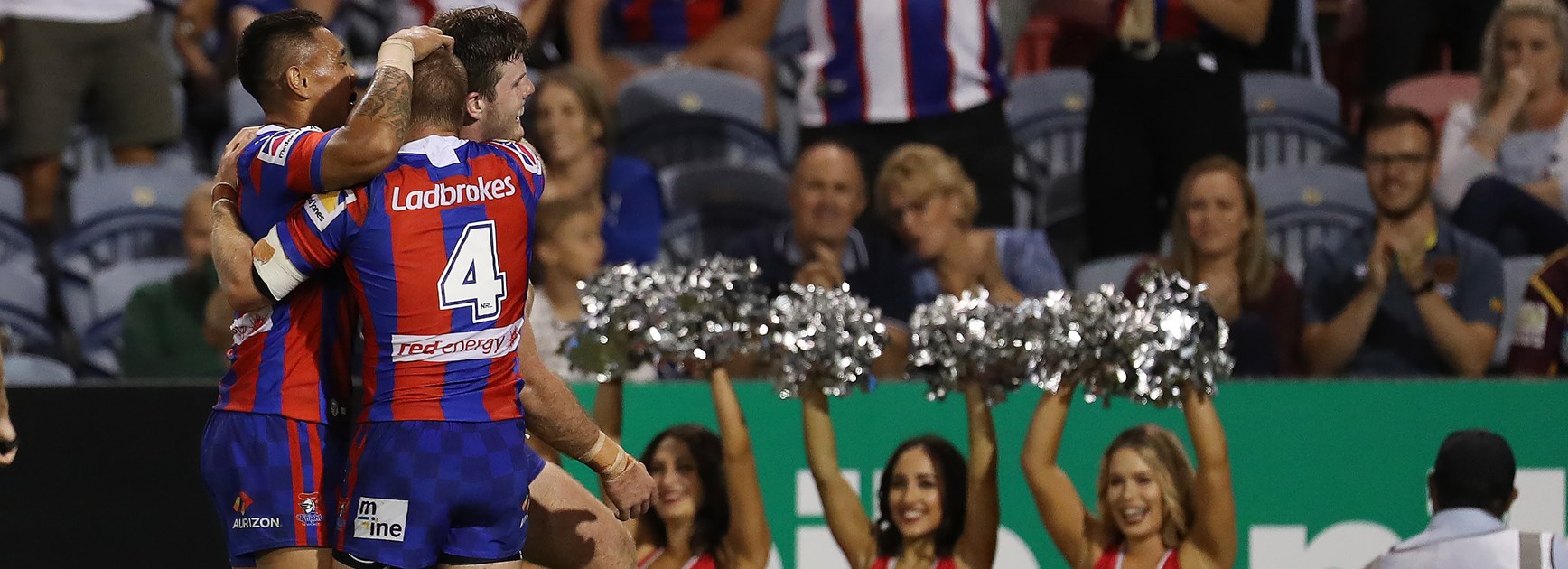 The Newcastle Knights celebrate a try.