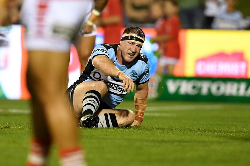Sharks lock Paul Gallen goes down hurt against the Dragons.
