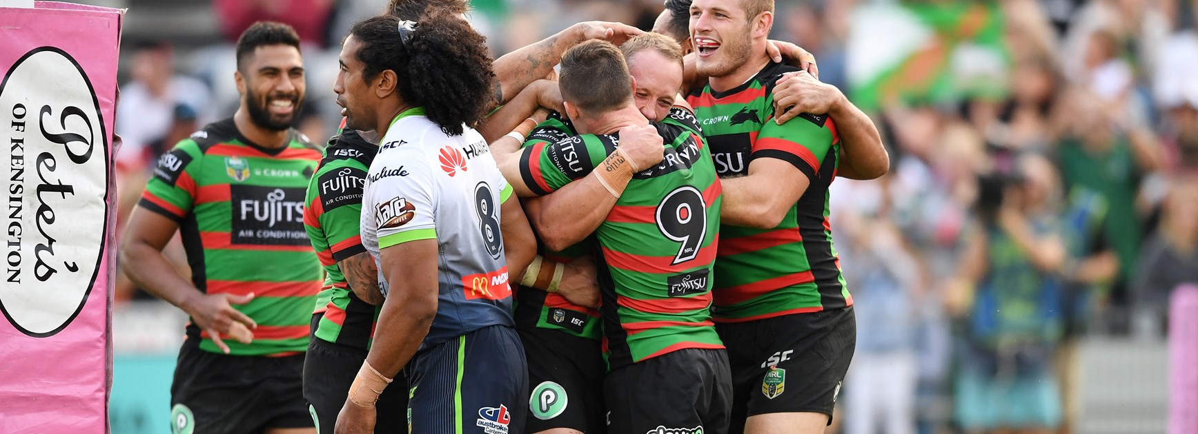 The Rabbitohs celebrate a try against Canberra in round seven.