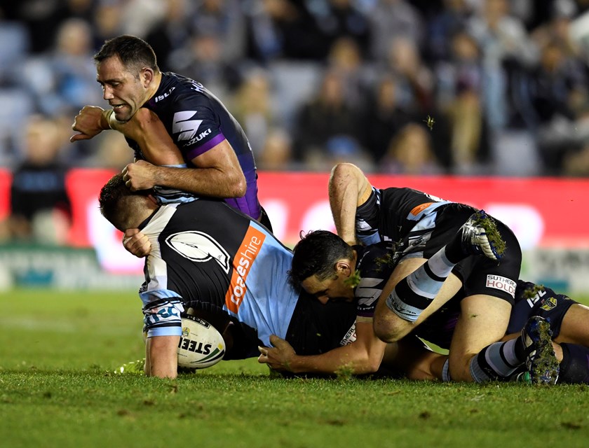 Cameron Smith and Billy Slater make a tackle.