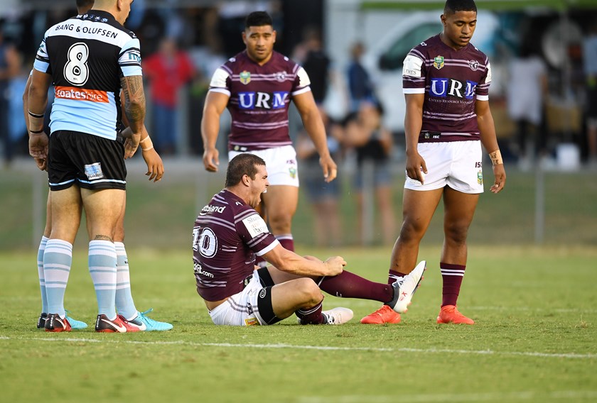 Manly prop Darcy Lussick suffers an ankle injury in a February trial against the Sharks.