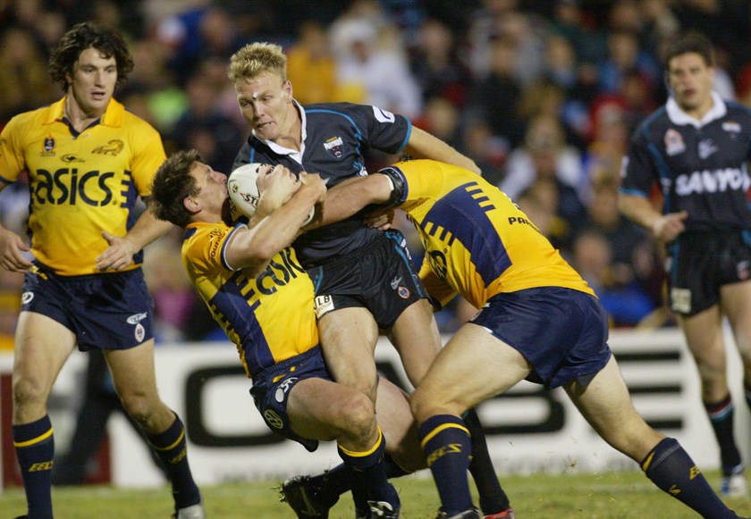 Luke Lewis tries to break the Parramatta defence in 2004.