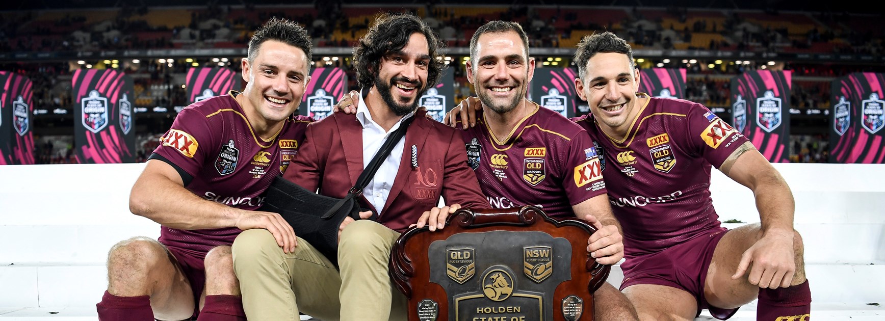 Cameron Smith (second from right) with the State of Origin shield.