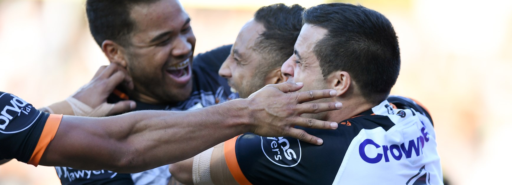 Wests Tigers players celebrate a Benji Marshall try.