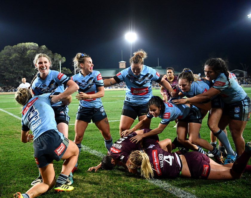 NSW players celebrate Isabelle Kelly's match-winner.