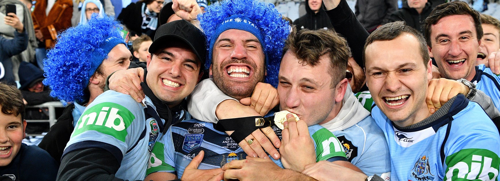 NSW fullback James Tedesco is swamped by fans.