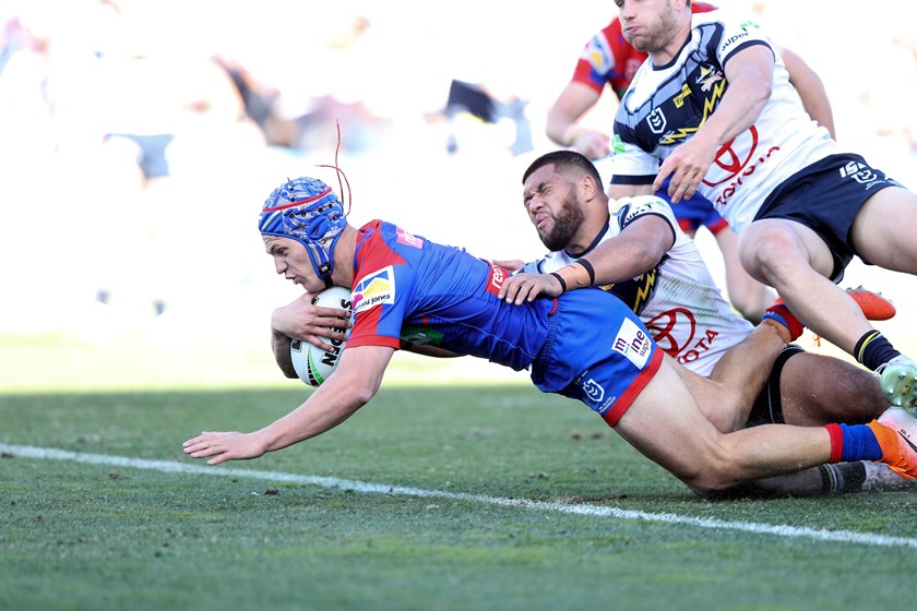 Knights star Kalyn Ponga crosses for a try.