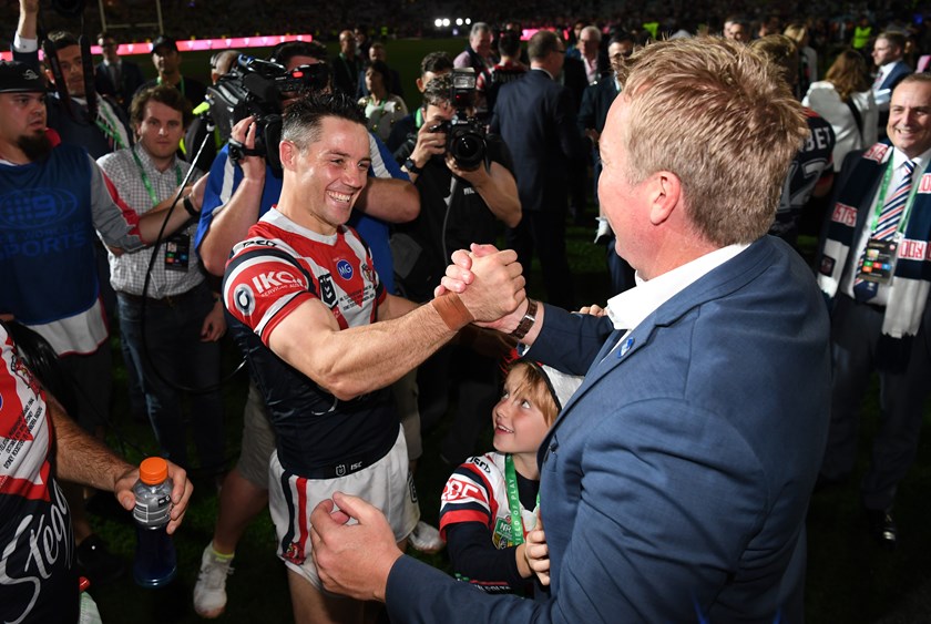 Cooper Cronk and coach Trent Robinson after winning the grand final. 