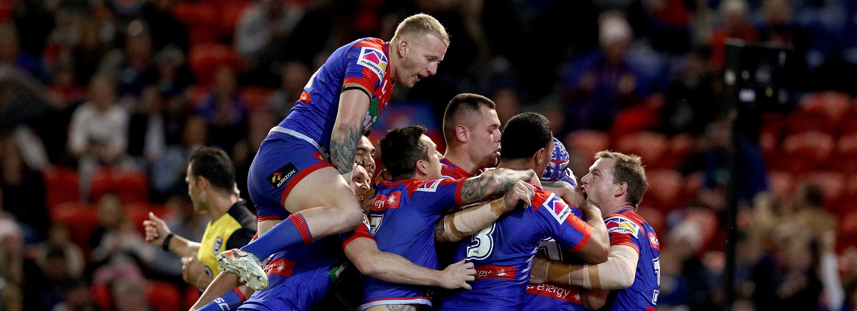 Knights players celebrate a try.