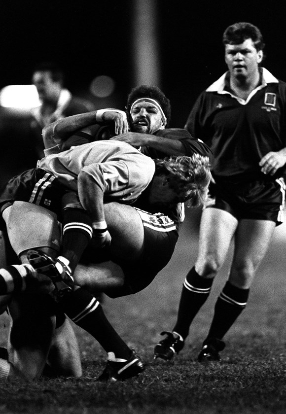 Maroons prop Greg Dowling is tackled.