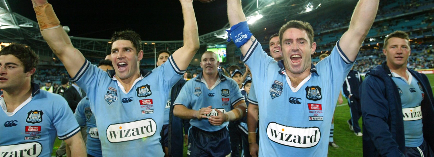 NSW Blues five-eighth Brad Fittler (right) celebrates the 2004 Origin series win.