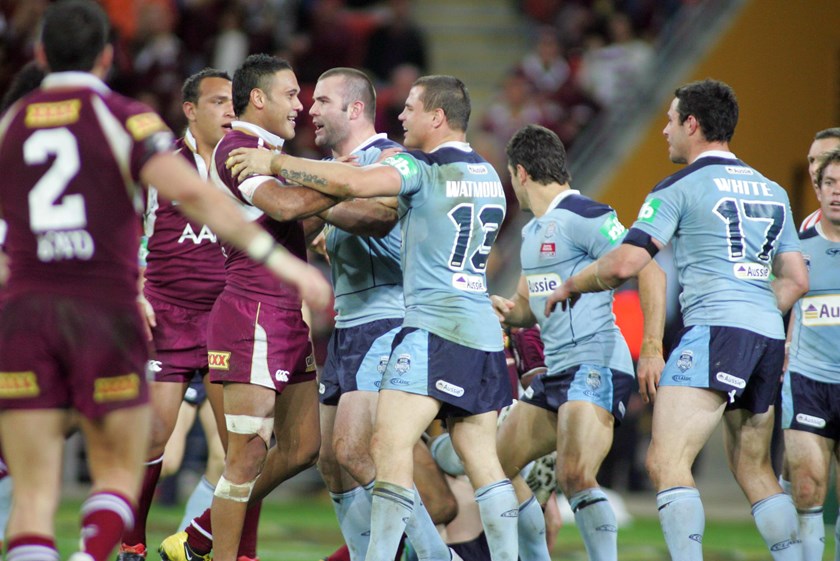 Justin Hodges and Anthony Watmough face off in 2009.