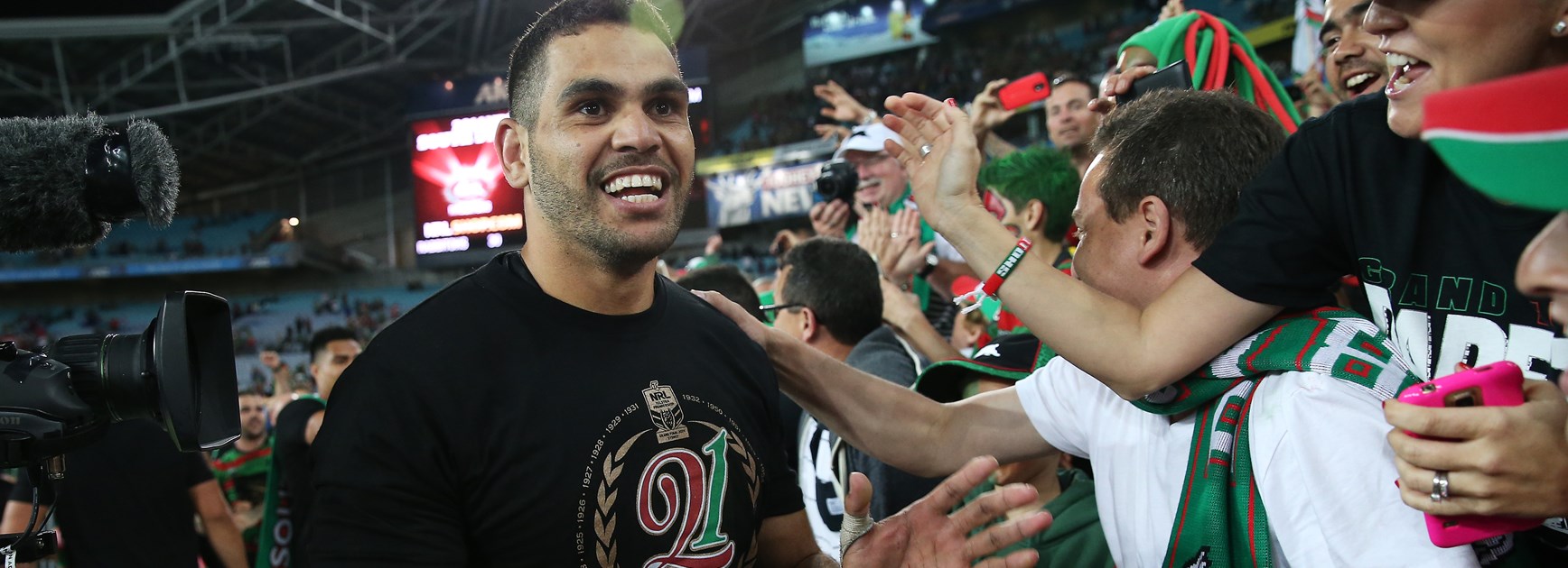 Greg Inglis greets fans after the 2014 grand final
