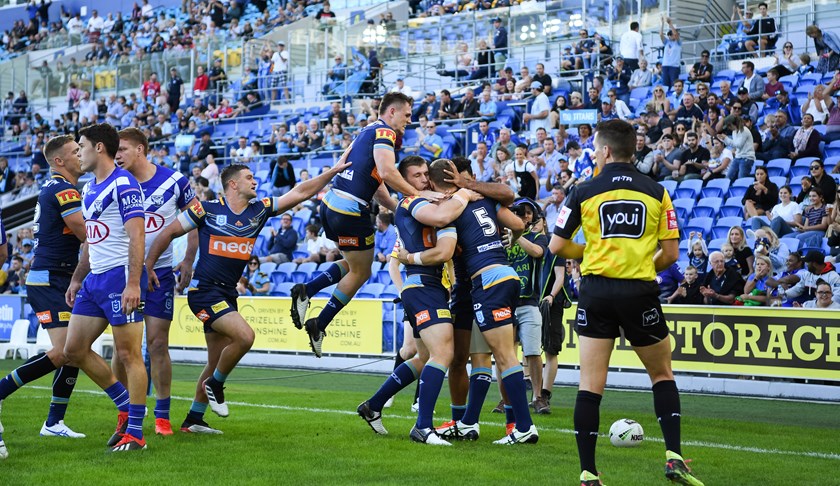 The Titans celebrate a Daly Copley try against the Bulldogs.