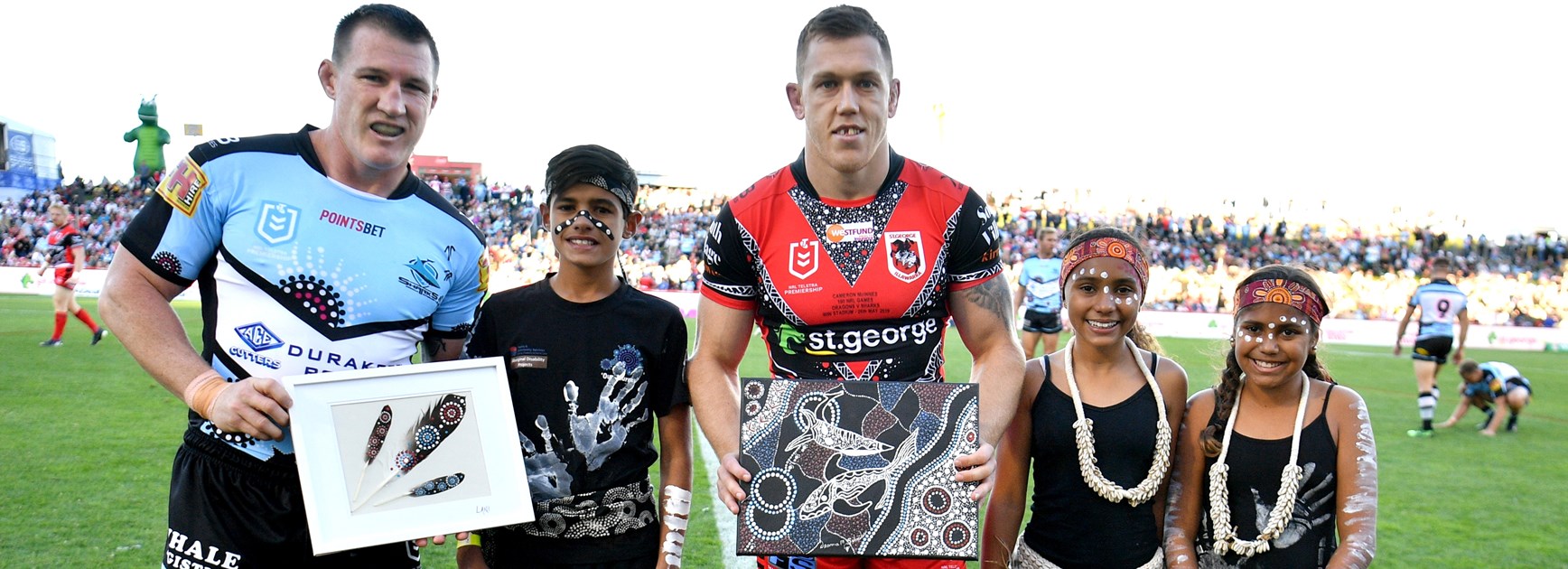 Paul Gallen and Cameron McInnes exchange gifts ahead of their Indigenous Round clash.