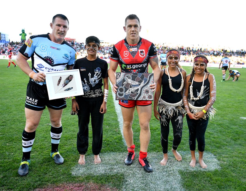 Paul Gallen and Cameron McInnes exchange gifts ahead of their Indigenous Round clash.