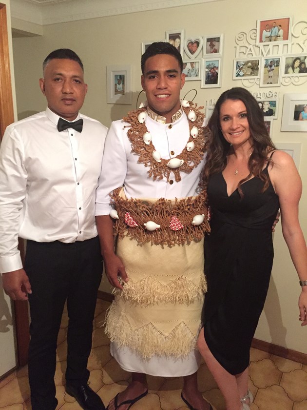 Joe Ofahangaue (centre) wearing traditional Tongan dress to mark his 21st birthday with father Josh and mother Kathy.