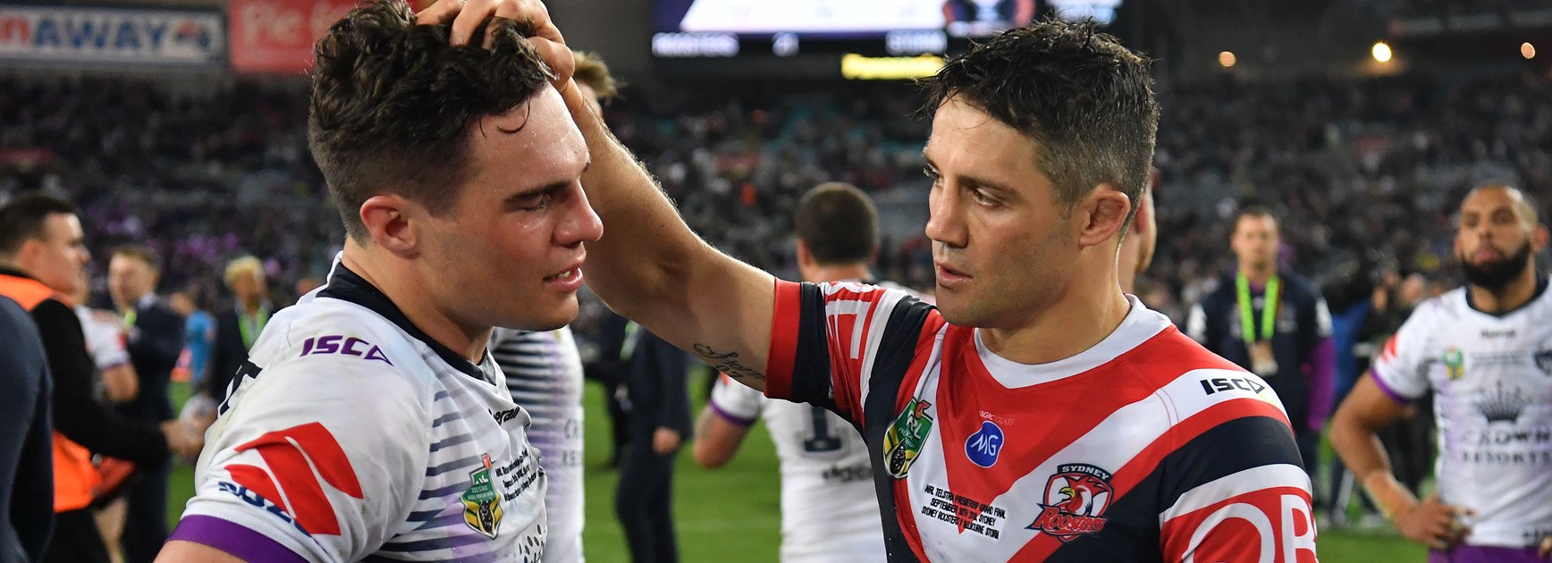 Brodie Croft and Cooper Cronk after the 2018 grand final.