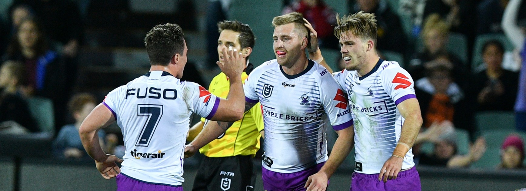 Storm trio Brodie Croft, Cameron Munster and Ryan Papenhuyzen celebrate a try.