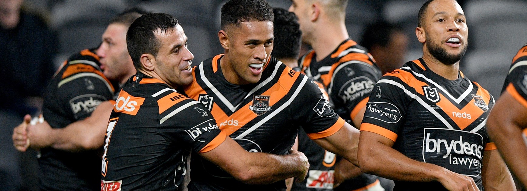 Wests Tigers utility Michael Chee-Kam celebrates a try.