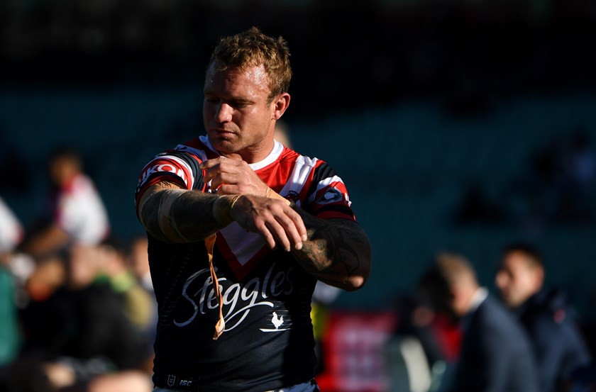Jake Friend leaves the field injured.
