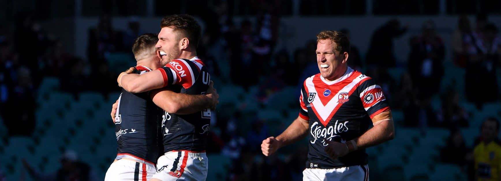 The Roosters celebrate a James Tedesco try.