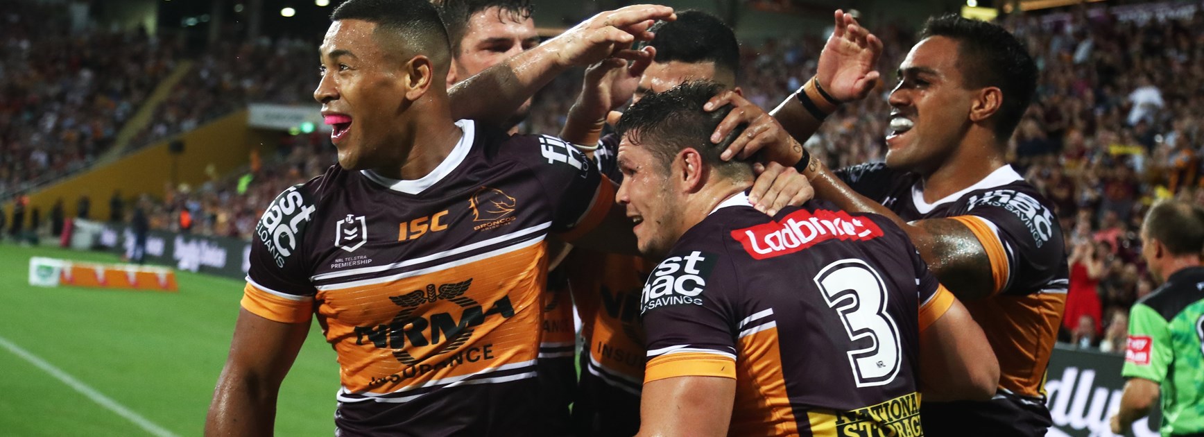 The Broncos celebrate a try.