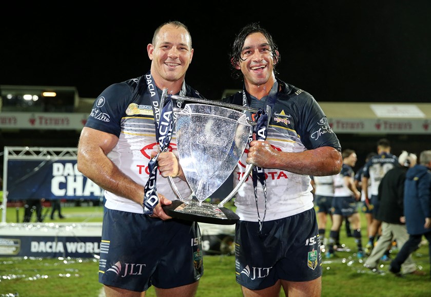 Matt Scott with Johnathan Thurston and the World Club Series trophy in 2016.